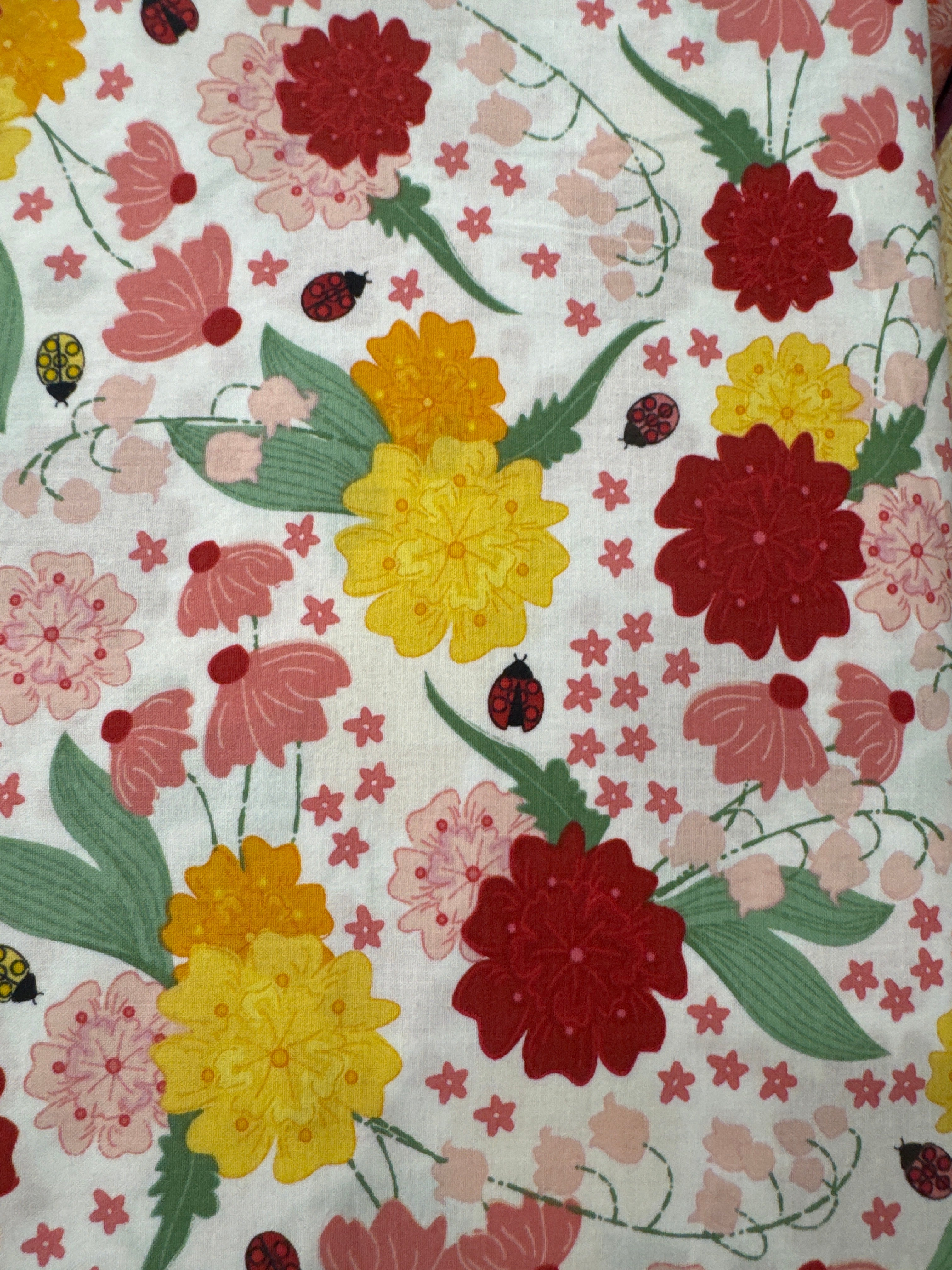 Ladybug Mania White novelty quilting fabric by Clothworks