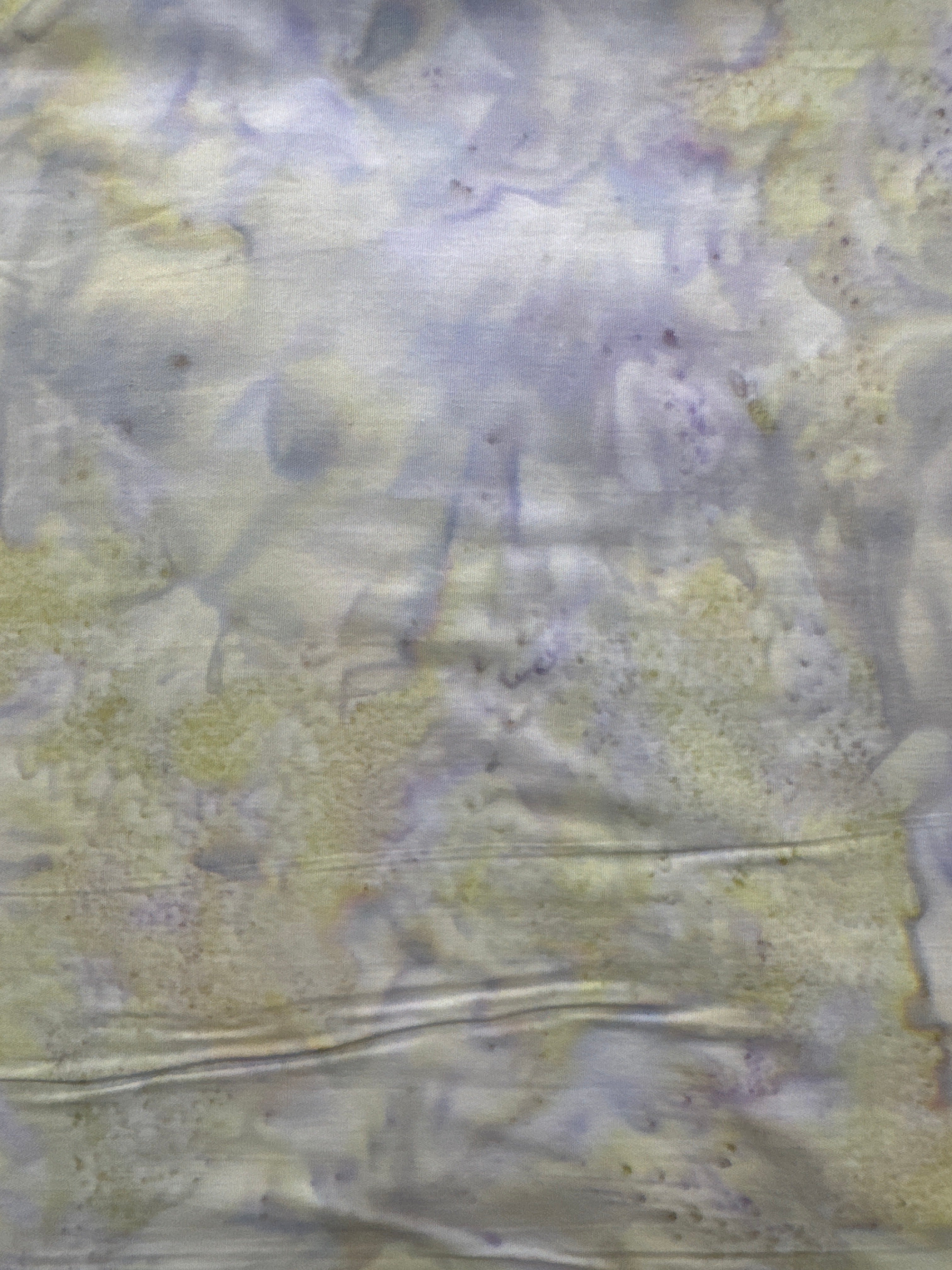 In The Beginning Watercolor Green and Purple quilting fabric