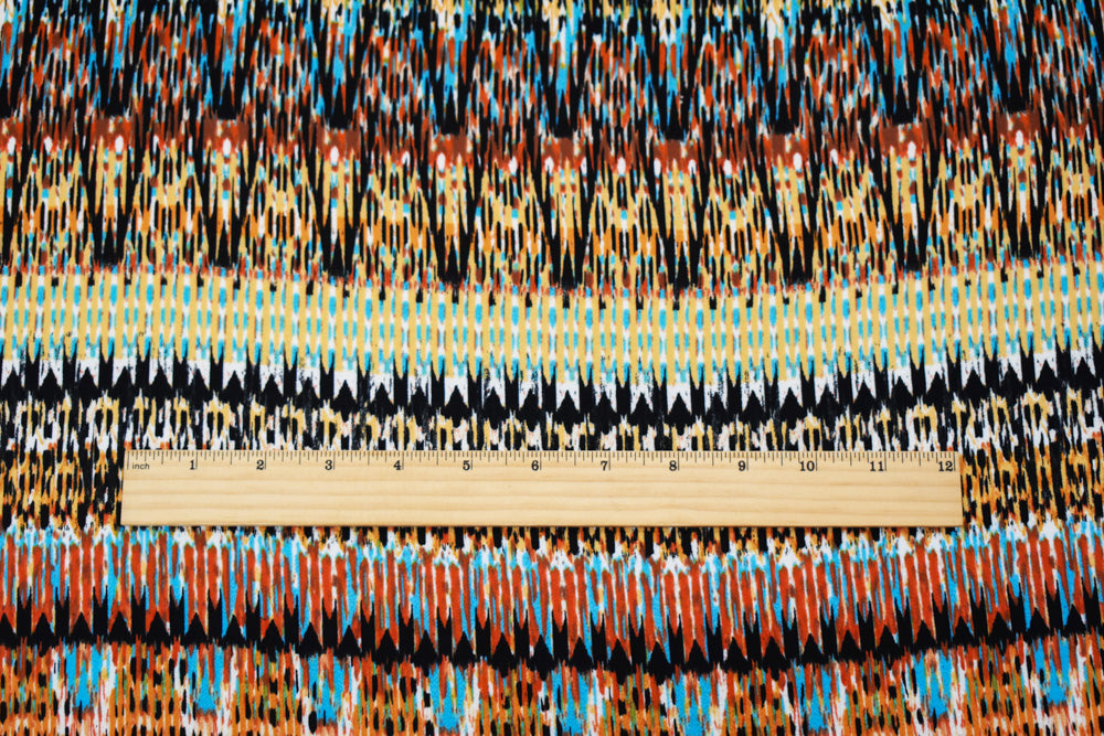 Orange-Turquoise-Multi Poly Aztec Ikat Printed Pebble Crepe Woven Fabric