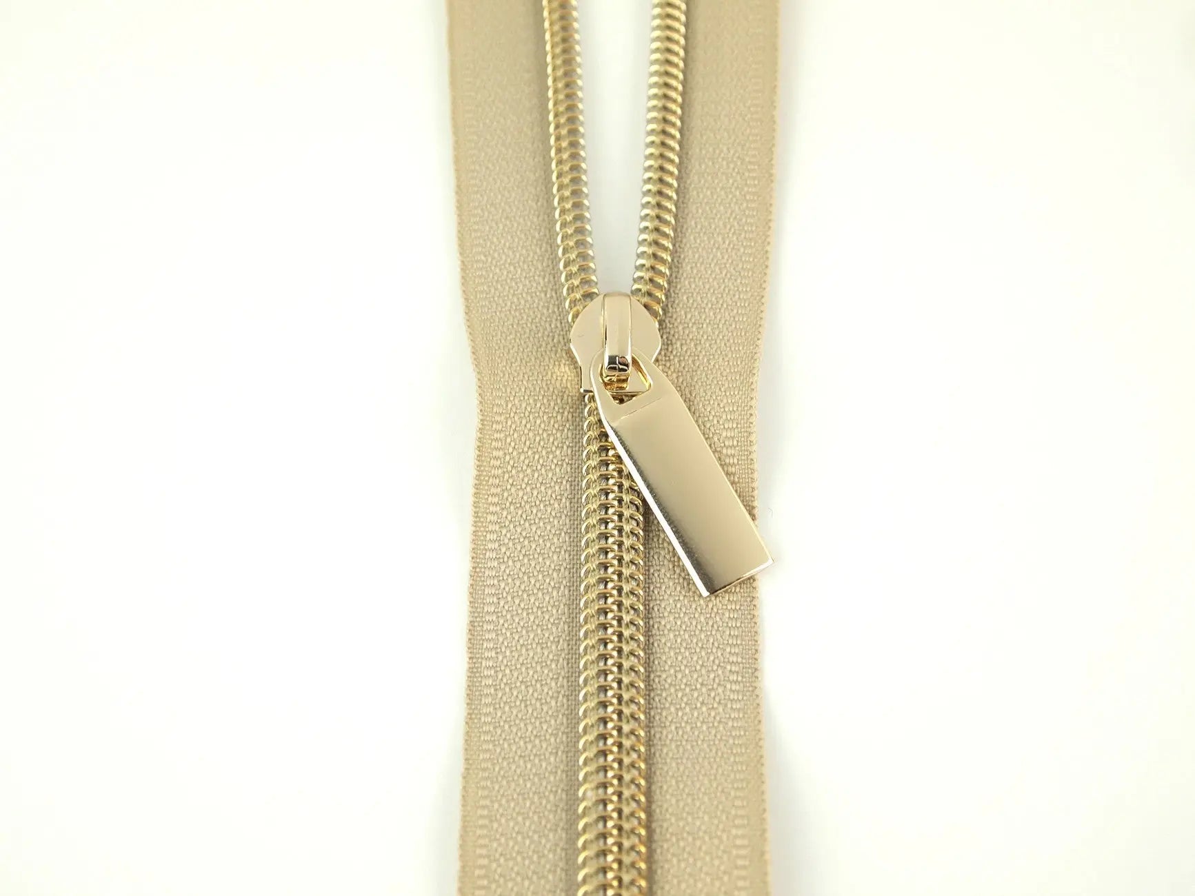 Beige #5 Nylon Gold Coil Zippers: 3 Yards with 9 Pulls - Linda's Electric Quilters