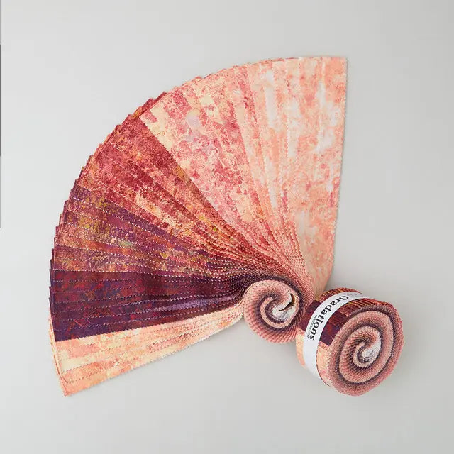 Jelly roll with burgundy, pink, and gold gradations of color and a stone textured appearance. The gorgeous colors and textures from Northcott’s Stonehenge line continue in the Stonehenge Gradations II collection by Linda Ludovico. The mottled colors of these fabrics make them fantastic blenders.