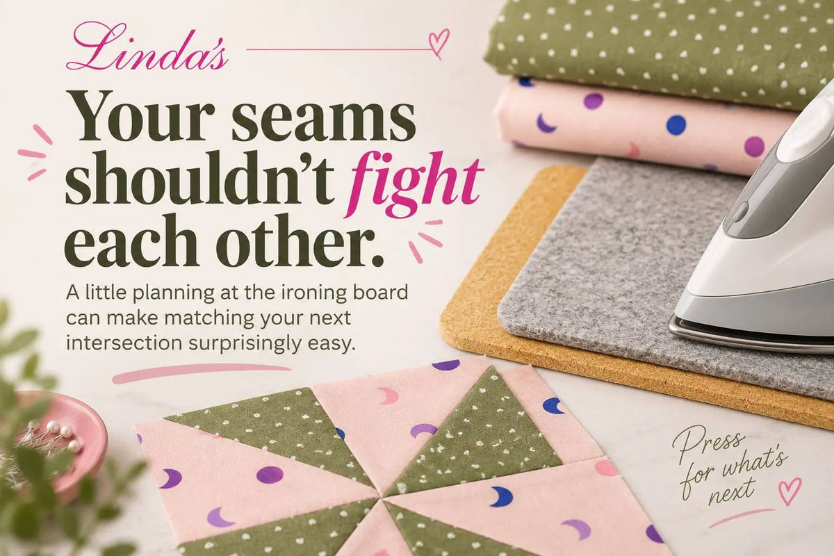 Flat lay of quilting supplies: stacked patterned fabrics, an iron resting on a wool pressing mat, and a pin cushion — pressing seams to nest for accurate piecing