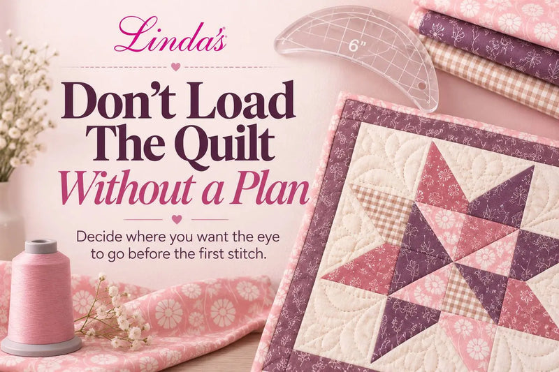 Pastel pink quilting flat lay with a large patchwork star quilt, folded floral fabrics, thread and a quilting ruler — planning where the quilting should go