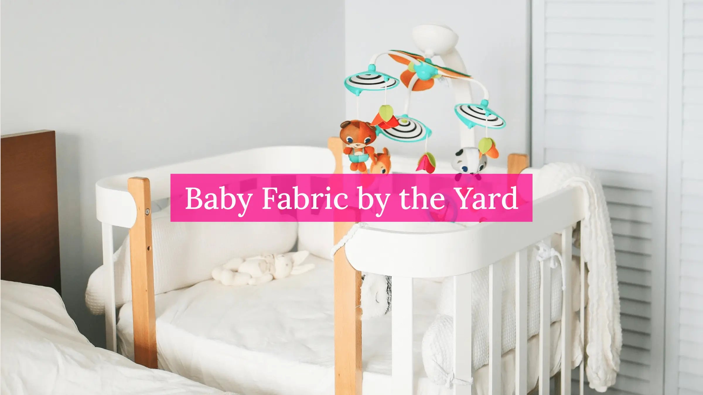 Soft baby fabrics folded in a nursery setting ready for sewing