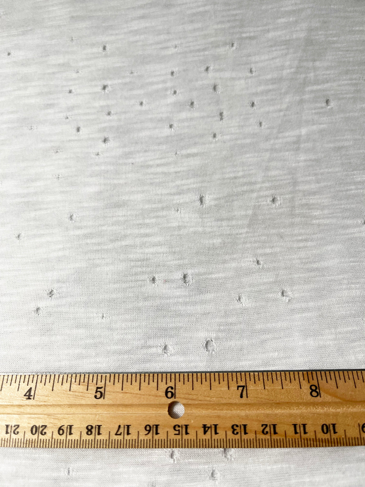 Solid White Distress Cut Jersey Knit Fabric - Linda's Electric